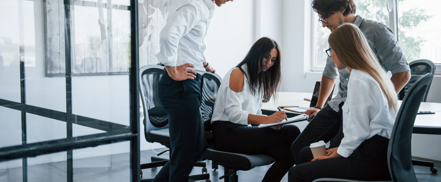 People conversing in an office meeting room
