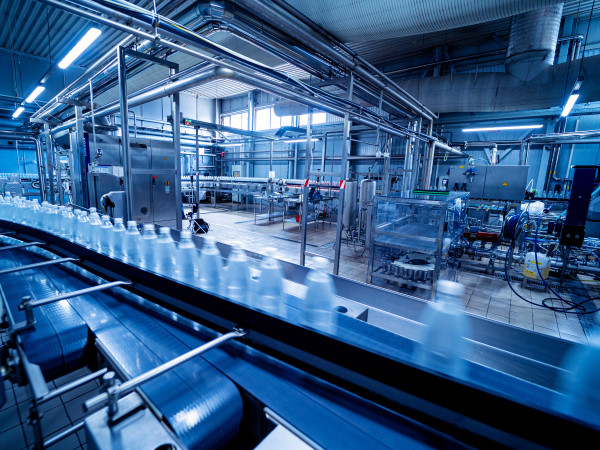 Bottles on a conveyor belt in a beverage plant