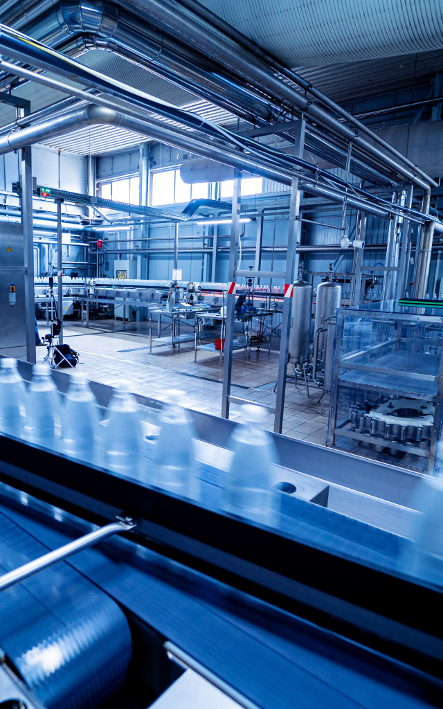 Bottles on a conveyor belt in a beverage plant