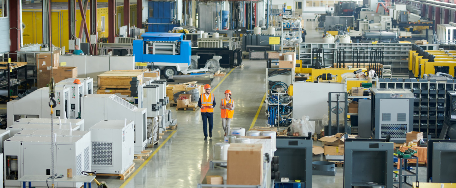 Construction workers walking in a warehouse
